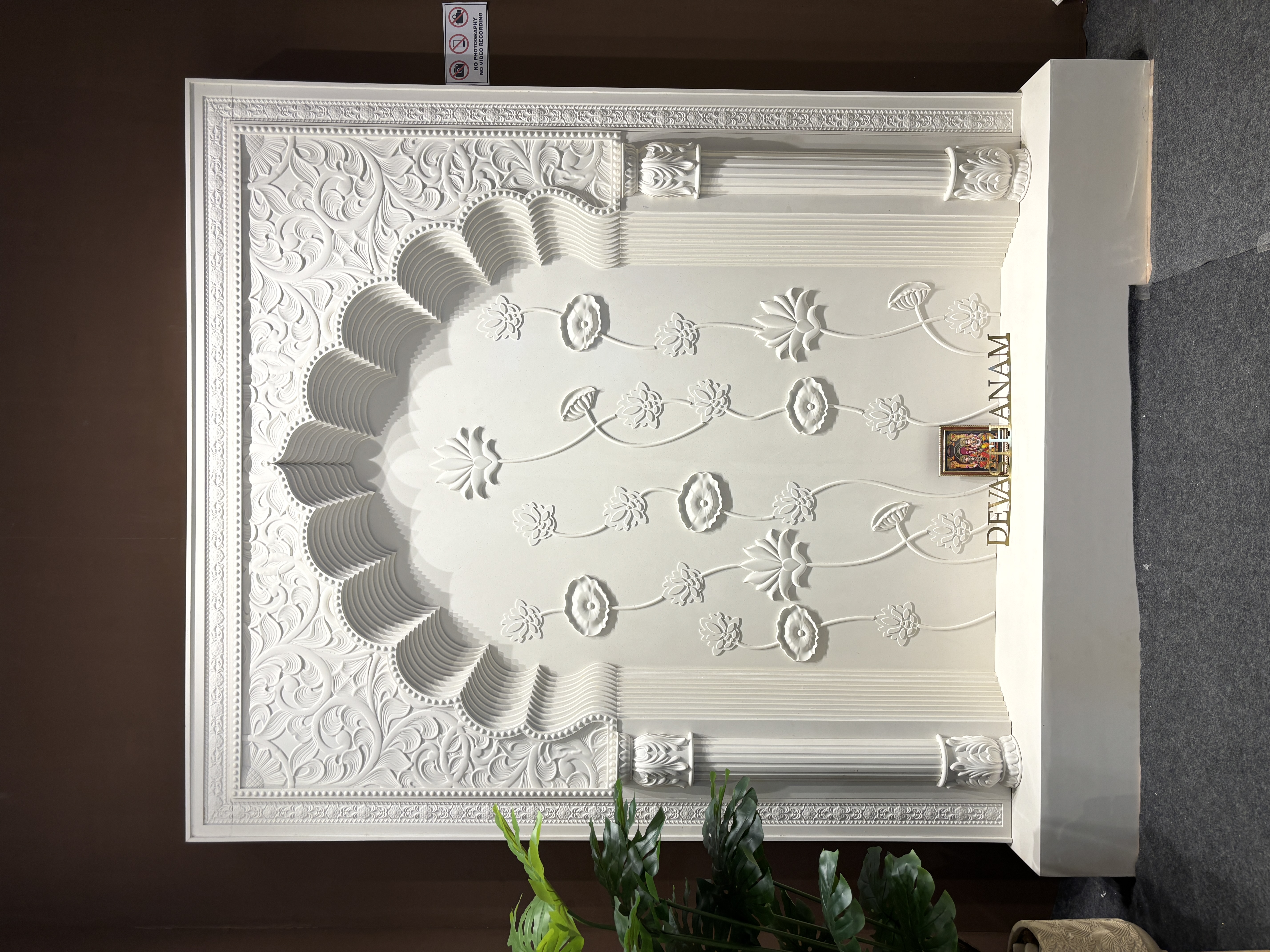 Corian wall panel with floral relief carvings