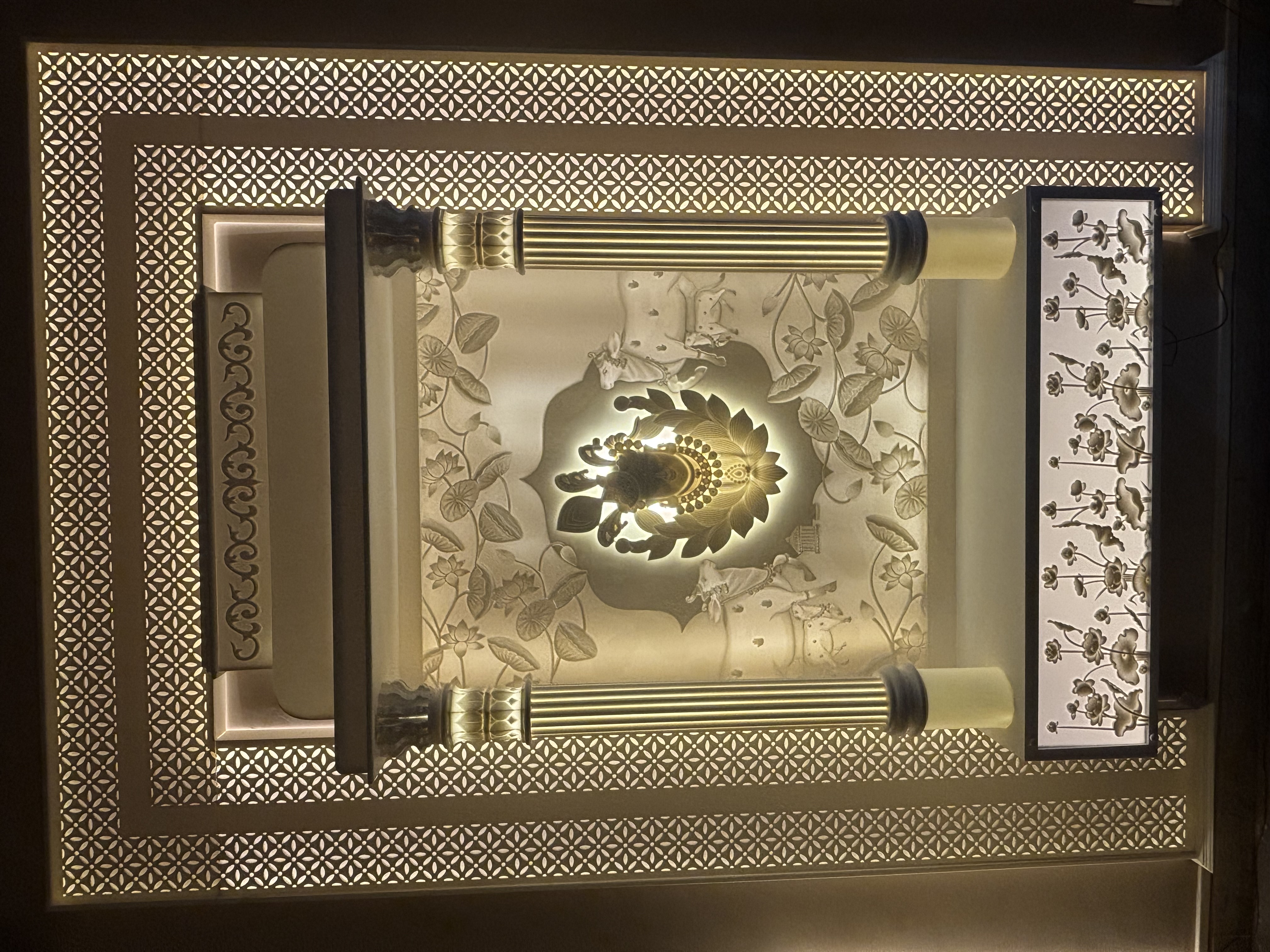 Gold illuminated Corian Mandir interior